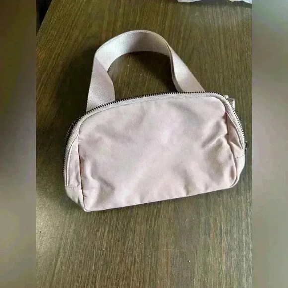 Light Pink Fanny Bag. Zip Closure. Pockets. Adjustable. 5”x9”. - Picture 1 of 8